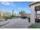 Backyard patio with dining and seating areas, lush landscaping at 3525 E Robin Ln, Phoenix, AZ 85050