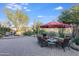 Relaxing backyard patio with fire pit, seating area, and desert landscaping at 3525 E Robin Ln, Phoenix, AZ 85050