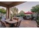 Spacious backyard patio with dining and seating areas, desert landscaping at 3525 E Robin Ln, Phoenix, AZ 85050