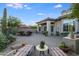 Large backyard patio with multiple seating areas and a built-in grill at 3525 E Robin Ln, Phoenix, AZ 85050