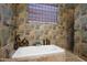 Bathroom with soaking tub and separate shower at 3525 E Robin Ln, Phoenix, AZ 85050