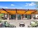 Community patio with seating area and fireplace, offering a relaxing space at 3525 E Robin Ln, Phoenix, AZ 85050