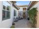Inviting courtyard entry with brick accents and seating area at 3525 E Robin Ln, Phoenix, AZ 85050
