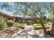 Relaxing courtyard with fountain, lush landscaping, and walkway at 3525 E Robin Ln, Phoenix, AZ 85050