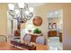 Bright dining area with chandelier and views into the kitchen at 3525 E Robin Ln, Phoenix, AZ 85050