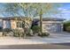 Single-story home with desert landscaping and a two-car garage at 3525 E Robin Ln, Phoenix, AZ 85050