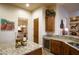 Kitchen features granite countertops, wine cooler, and custom cabinetry at 3525 E Robin Ln, Phoenix, AZ 85050