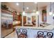 Gourmet kitchen boasts granite counters, stainless steel appliances, and custom wood cabinetry at 3525 E Robin Ln, Phoenix, AZ 85050