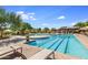 Community lap pool and leisure pool with plenty of lounge chairs at 3525 E Robin Ln, Phoenix, AZ 85050