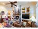 Comfortable living room with a stone fireplace and built-in entertainment center at 3525 E Robin Ln, Phoenix, AZ 85050