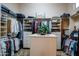 Large walk-in closet with ample shelving and hanging space at 3525 E Robin Ln, Phoenix, AZ 85050
