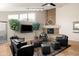 Common area with fireplace, comfortable seating, and TV at 3825 E Camelback Rd # 290, Phoenix, AZ 85018