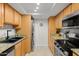 Kitchen with stainless steel appliances and washer/dryer at 3825 E Camelback Rd # 290, Phoenix, AZ 85018
