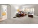Living room with leather sofa, view of bathroom, and balcony at 3825 E Camelback Rd # 290, Phoenix, AZ 85018
