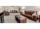 Living room with two leather sofas, coffee table, and exercise equipment at 3825 E Camelback Rd # 290, Phoenix, AZ 85018