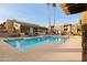 Community pool with lounge chairs and patio furniture at 3825 E Camelback Rd # 290, Phoenix, AZ 85018