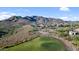 Aerial view of golf course community with luxury homes and desert landscape at 42034 N Harbour Town Ct, Anthem, AZ 85086