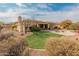 Artificial turf backyard with fire pit and patio at 42034 N Harbour Town Ct, Anthem, AZ 85086