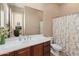 Bathroom with single vanity and shower/tub combo at 42034 N Harbour Town Ct, Anthem, AZ 85086