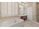 Elegant bathroom with soaking tub and double vanity at 42034 N Harbour Town Ct, Anthem, AZ 85086