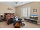 Bedroom with king-size bed and TV at 42034 N Harbour Town Ct, Anthem, AZ 85086