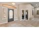 Elegant entryway with tile floors and French doors leading to additional rooms at 42034 N Harbour Town Ct, Anthem, AZ 85086