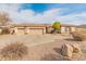 Single story home with three car garage and desert landscaping at 42034 N Harbour Town Ct, Anthem, AZ 85086