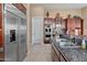 Modern kitchen with stainless steel appliances and granite countertops at 42034 N Harbour Town Ct, Anthem, AZ 85086