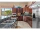 Kitchen boasts granite countertops, stainless steel appliances, and ample cabinetry at 42034 N Harbour Town Ct, Anthem, AZ 85086