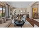Spacious living area with hardwood floors and large windows at 42034 N Harbour Town Ct, Anthem, AZ 85086