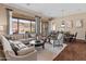 Bright living room with hardwood floors and views at 42034 N Harbour Town Ct, Anthem, AZ 85086