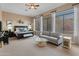 Bright main bedroom with large windows and sitting area at 42034 N Harbour Town Ct, Anthem, AZ 85086