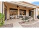Covered patio with ceiling fans and comfortable seating at 42034 N Harbour Town Ct, Anthem, AZ 85086