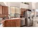 Kitchen area with stainless steel appliances and wood cabinets at 4293 S Columbine Way, Gold Canyon, AZ 85118