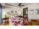 Bright bedroom with hardwood floors and colorful bedding at 4422 N 75Th St # 7009, Scottsdale, AZ 85251