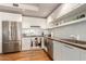 Modern kitchen with stainless steel appliances and white cabinetry at 4422 N 75Th St # 7009, Scottsdale, AZ 85251