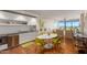 Open concept kitchen with white cabinets, stainless steel appliances, and dining area at 4422 N 75Th St # 7009, Scottsdale, AZ 85251