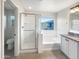 Elegant bathroom with soaking tub, shower and granite vanity at 4738 E Tierra Buena Ln, Phoenix, AZ 85032