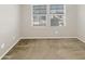 Bright bedroom with carpet flooring and large windows at 4738 E Tierra Buena Ln, Phoenix, AZ 85032