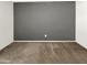 Large bedroom with grey accent wall and neutral carpet at 4738 E Tierra Buena Ln, Phoenix, AZ 85032
