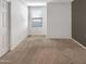 Bright bedroom with neutral carpet and window with blinds at 4738 E Tierra Buena Ln, Phoenix, AZ 85032