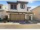 Two-story stucco home with a brown garage door and landscaped yard at 4738 E Tierra Buena Ln, Phoenix, AZ 85032