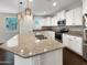 Modern kitchen with white cabinets, granite countertops, and stainless steel appliances at 4738 E Tierra Buena Ln, Phoenix, AZ 85032