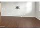Bright and airy living room with dark brown hardwood floors at 4738 E Tierra Buena Ln, Phoenix, AZ 85032