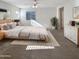 Large main bedroom with carpeted floors and a ceiling fan at 4738 E Tierra Buena Ln, Phoenix, AZ 85032