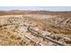 Aerial view of community showing homes and desert landscape at 47970 N Navidad Ct, Gold Canyon, AZ 85118