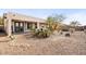 Landscaped backyard with gravel and fire pit at 47970 N Navidad Ct, Gold Canyon, AZ 85118