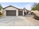 Two-car garage and desert landscaping at 47970 N Navidad Ct, Gold Canyon, AZ 85118