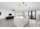 Modern kitchen with a large marble island and stainless steel appliances at 47970 N Navidad Ct, Gold Canyon, AZ 85118