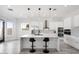Modern kitchen with white cabinets, marble island, and stainless steel appliances at 47970 N Navidad Ct, Gold Canyon, AZ 85118